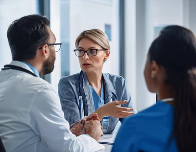 Firefly serious employer discussing with her staff in hospital office 4362